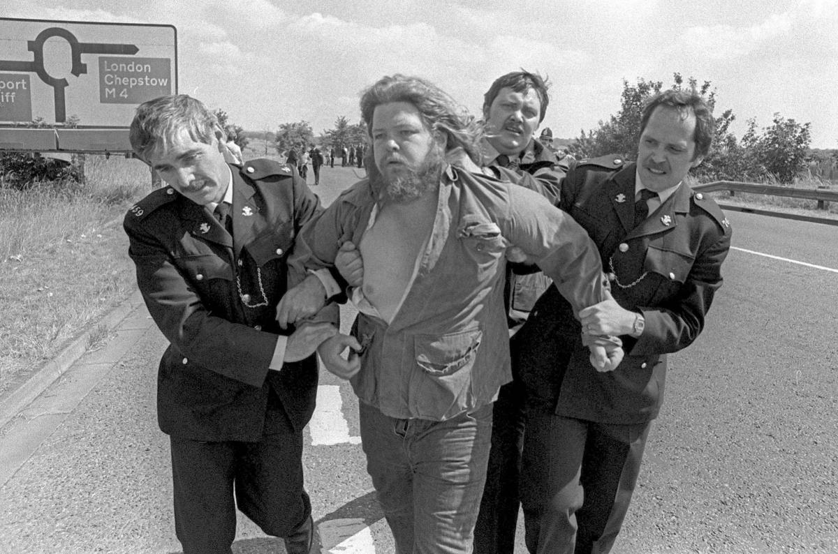 One of seven miners who were arrested near Llanwern Steelworks being led away by the police [https://www.southwalesargus.co.uk/]