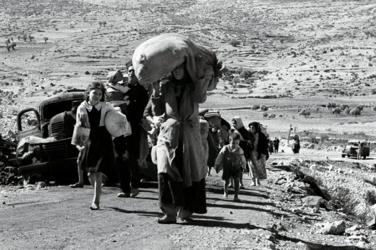 Palestinian civilians forced to flee from an unidentified village in Galilee some five months after the creation of the state of Israel [Reuters]