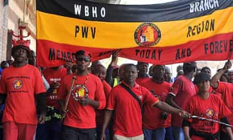 Members of the National Union of Mineworkers take part in a strike in Johannesburg [theguardian.com]