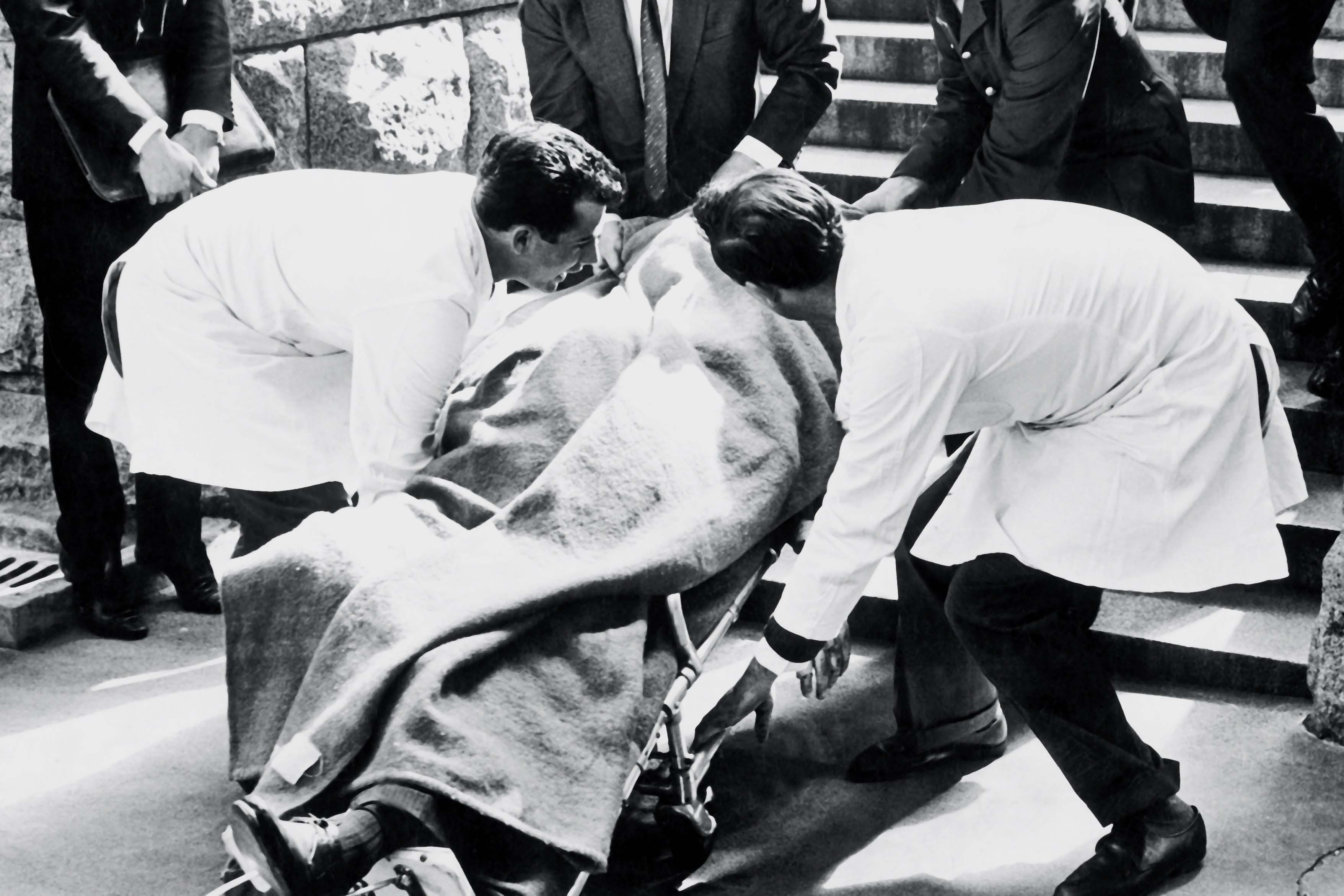 The body of Hendrik Verwoerd, leader of the National Party and South African prime minister from 1958 to 1966, is carried out of Parliament after he was assassinated by Dimitri Tsafendas. (Photograph by Die Burger/Media24)