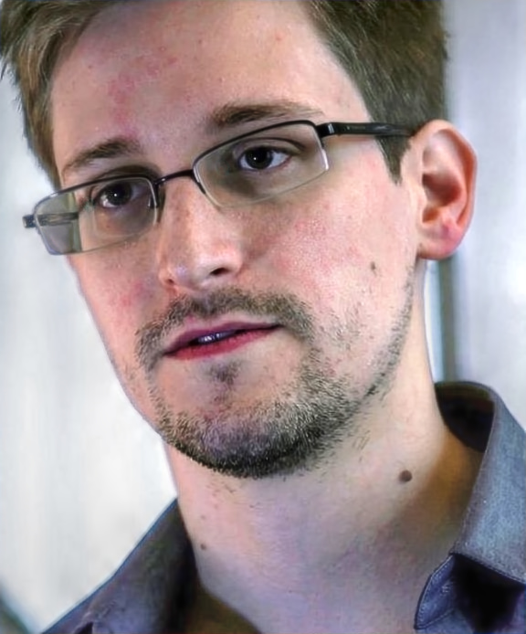 Edward Snowden speaks about the NSA leaks in an interview with reporter Glenn Greenwald at the hotel The Mira Hong Kong. [Wikipedia]