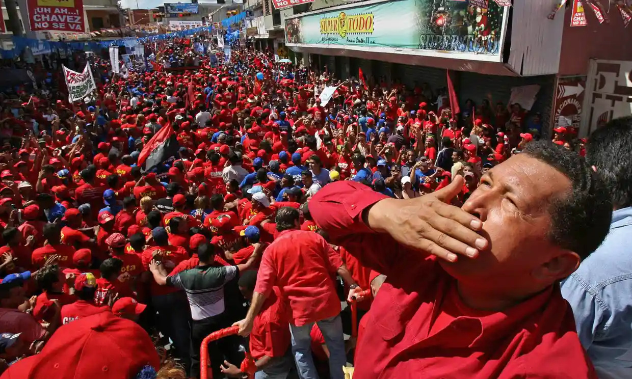 Hugo Chávez greeting supporters during a political gathering in the town of Guarico in 2006 [theguardian.com]