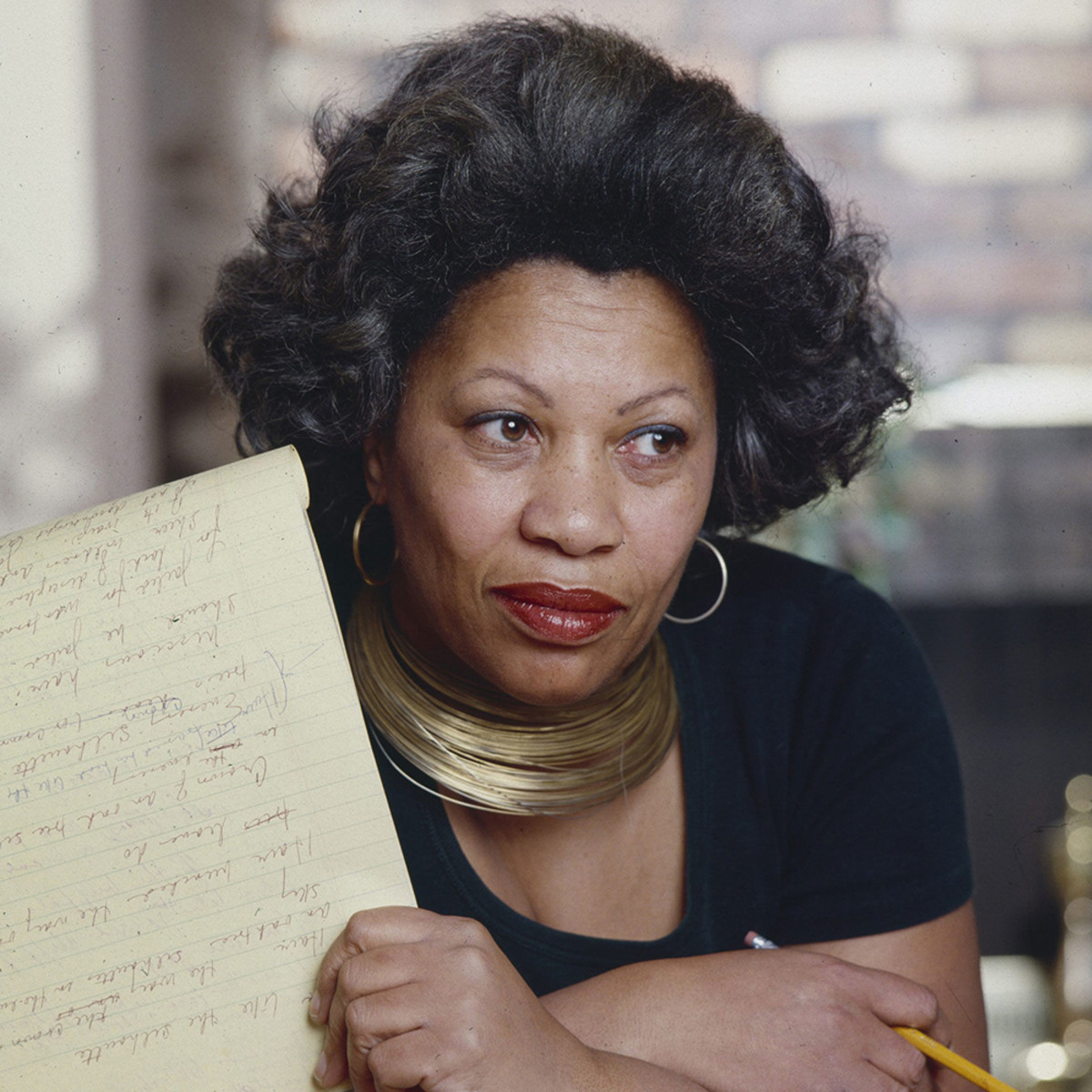 Toni Morrison holding a manuscript. Photo credit to Jack Mitchell.